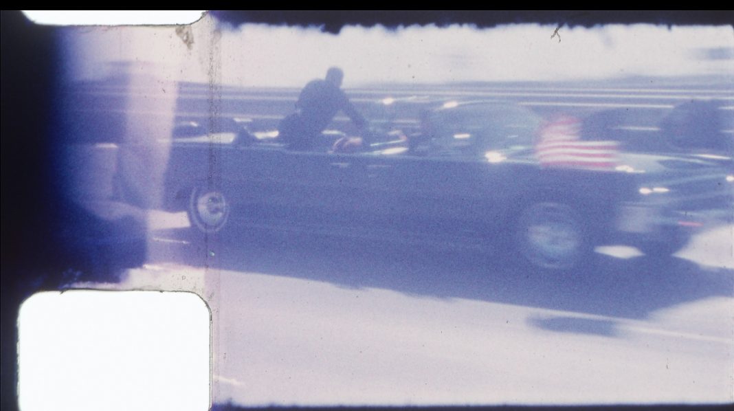 A frame from an 8mm color footage of John F. Kennedy motorcade thorugh Dallas